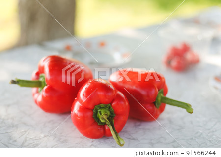 Sweet red fresh Bell pepper on a white table 91566244