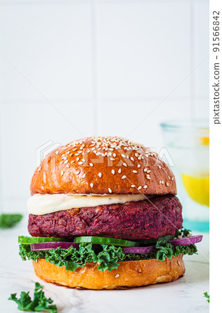 Beetroot vegan burger with kale, onion and cucumber. Alternative fast food. Purple food. Beetroot vegan burger with kale, onion and cucumber. Alternative fast food. Purple food. 91566842