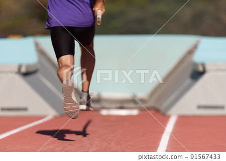 Run-up male athlete pole vault at athletics competition 91567433