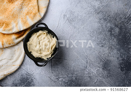Healthy Creamy Hummus set, on gray stone table background, top view flat lay, with copy space for text 91568627