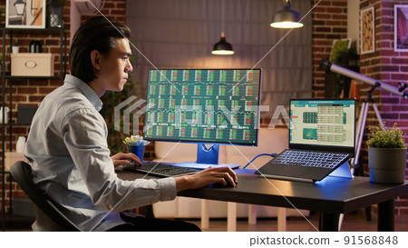 Financial analyst looking at real time trade exchange statistics, analyzing stock market forex investment with capital money. Global banking with hedge fund profit and currency. . 91568848