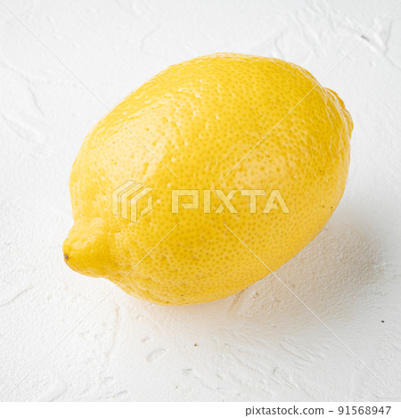 Whole lemons, on white stone table background 91568947