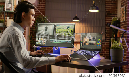 Graphic designer working on editing footage software to edit video montage with color gradient and visual effects. Sound and film production design, creating digital movie on app. . Graphic designer working on editing footage software to edit video montage with color gradient and visual effects. Sound and film production design, creating digital movie on app. . 91568981