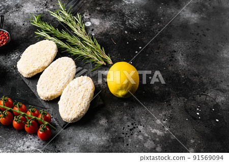 Fishcake burger , on black dark stone table background, top view flat lay, with copy space for text Fishcake burger , on black dark stone table background, top view flat lay, with copy space for text 91569094