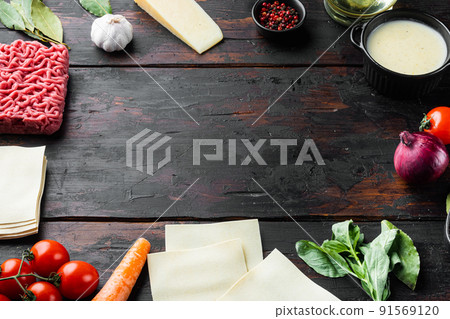 Empty space clean Frame The concept of cooking lasagna. Italian Ingredients, lasagna sheets meat herbs tomatoes, bechamel sauce, on old dark wooden table background Empty space clean Frame The concept of cooking lasagna. Italian Ingredients, lasagna sheets meat herbs tomatoes, bechamel sauce, on old dark wooden table background 91569120