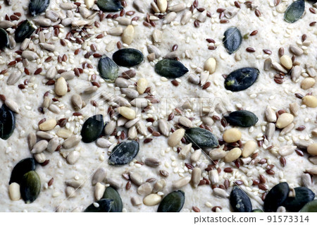 Different seeds decorate bread and other pastries. Different seeds decorate bread and other pastries. 91573314