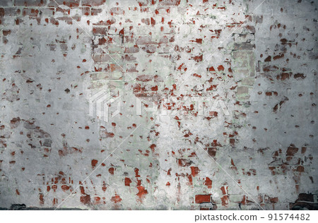 Dilapidated building facade with damaged plaster Dilapidated building facade with damaged plaster 91574482