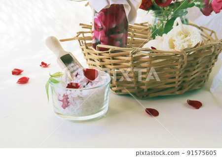 Fresh pink and purple roses, water and sea salt with flower petals, on a light background, natural cosmetics, body care, love emotion 91575605