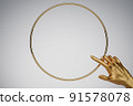 Human golden hand pointing in golden ring frame. Background for cosmetics, fashion, product show. 3D rendering. 91578078