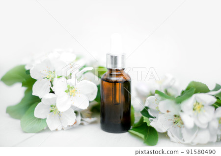 Natural beauty anti-aging products for face and hand skin care for women with sunscreen with fresh apple blossoms. Advertising of spring and summer cosmetics. natural cosmetics and aromatherapy 91580490