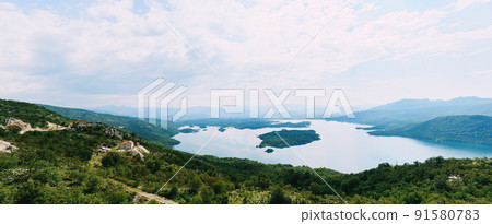 Island in the middle of Lake Slansko. Montenegro Island in the middle of Lake Slansko. Montenegro 91580783