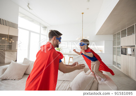 Father and son play superhero Father and son play superhero 91581095