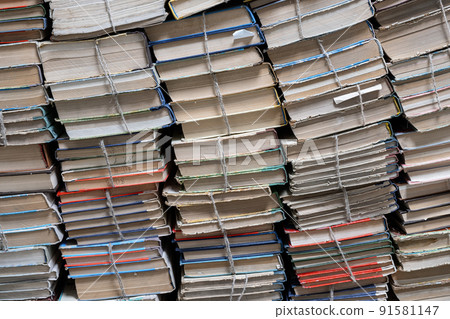 Stack of books in library. Book texture. Different vintage books in row. 91581147