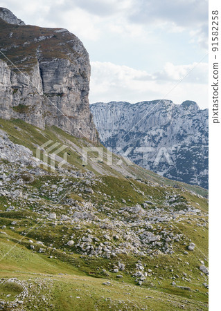 Stone mountain on the background of the ridge of the Sedlo Pass in the Durmitor National Park 91582258