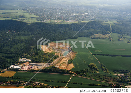 View from the plane window of the green plains and wooded hills of Budapest View from the plane window of the green plains and wooded hills of Budapest 91582728