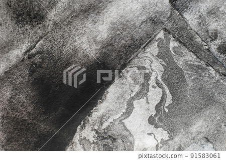 Grunge background. Worn paper texture. Grain noise. Black paint stains on white weathered uneven abstract surface with free space. 91583061
