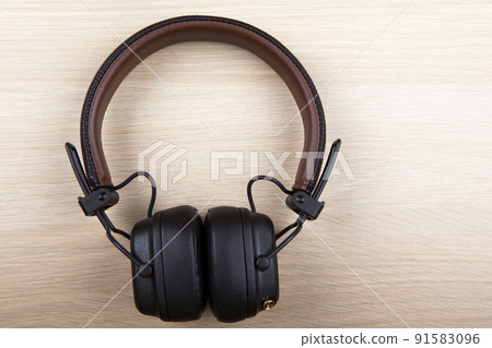 image of headphones wooden desk 91583096