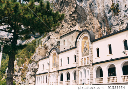 Walls of the Ostrog monastery with arched windows. Montenegro Walls of the Ostrog monastery with arched windows. Montenegro 91583654