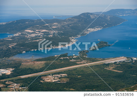 Green forest on the coast of the Bay of Kotor. Lovcen, Montenegro 91583656