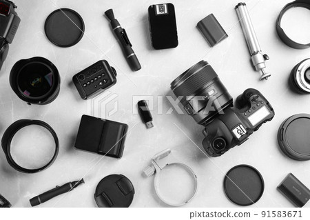 Flat lay composition with equipment for professional photographer on grey marble table 91583671