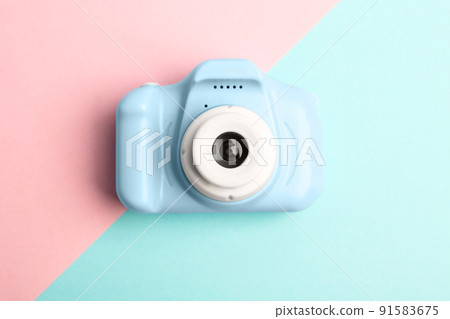 Light blue toy camera on color background, top view. Future photographer 91583675