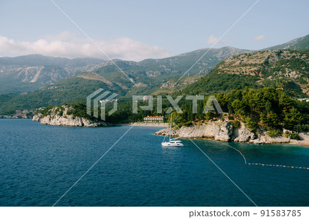 View from the island of Sveti Stefan on a boat sailing past the beach of Villa Milocer View from the island of Sveti Stefan on a boat sailing past the beach of Villa Milocer 91583785