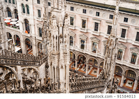 Arched passages and carved towers of the Duomo. Italy, Milan Arched passages and carved towers of the Duomo. Italy, Milan 91584013
