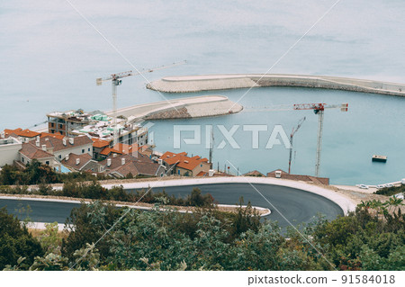 Buildings of the residential complex in the Lustica Bay. Montenegro Buildings of the residential complex in the Lustica Bay. Montenegro 91584018