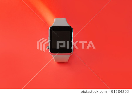 Smart watch with white silicone band side view on pink coral background. Trendy sports style watches on bracelet, 91584203