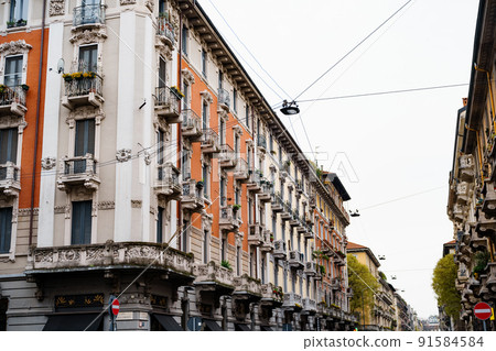 Carved stone balconies on the facade of the building. Milan, Italy 91584584