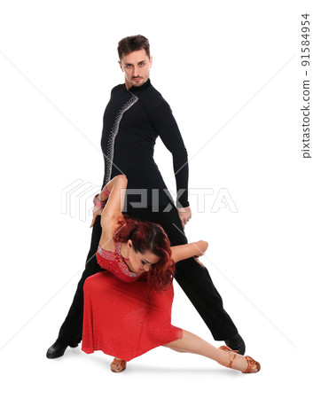 Passionate young couple dancing on white background Passionate young couple dancing on white background 91584954