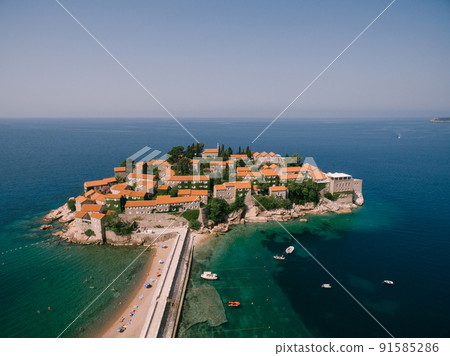 Ancient stone buildings on the island-hotel Sveti Stefan 91585286
