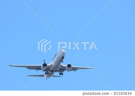 Passenger plane taking off; passenger plane rising 91585634
