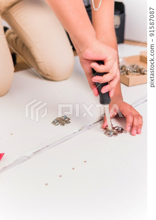 independent and success Bolivian Latin woman assembly and fix repair in moving house 91587087