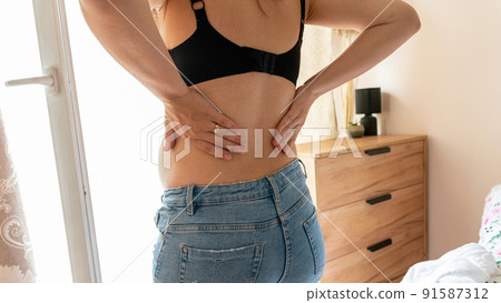 Pregnant back pain. Beautiful pregnancy woman suffer from back pain. Backache, ache health care concept. 91587312