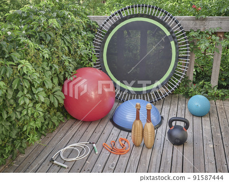 home gym concept on a backyard patio home gym concept on a backyard patio 91587444