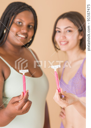 hair removal body care depilation with razor. skin cosmetology with Latin Cuban and Moroccan woman hair removal body care depilation with razor. skin cosmetology with Latin Cuban and Moroccan woman 91587475