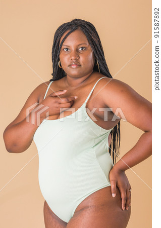 curvy plus size model. overweight body acceptance confidence. Latin Cuban body positive unretouched 91587892