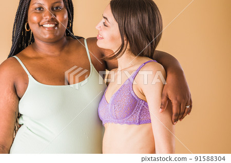 body positivity and inclusivity feminity friends. interracial Moroccan and Cuban Latin woman 91588304