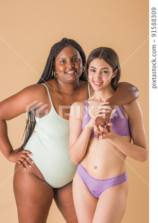 body positivity and inclusivity feminity friends. interracial Moroccan and Cuban Latin woman 91588309