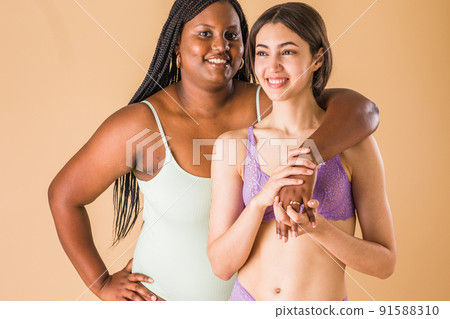body positivity and inclusivity feminity friends. interracial Moroccan and Cuban Latin woman 91588310