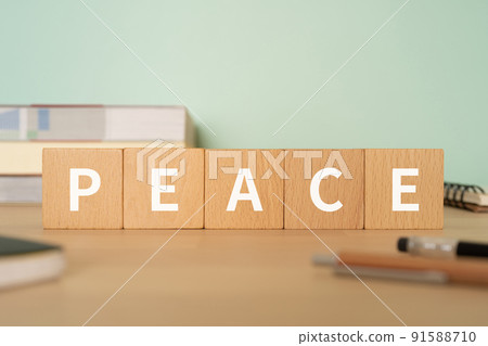 Image of Peace | Desk with a block labeled "PEACE" 91588710