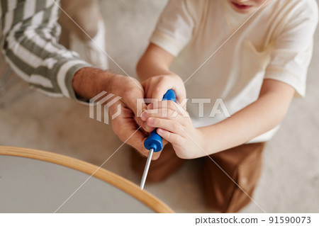 Cute Boy Assembling Wooden Chair Cute Boy Assembling Wooden Chair 91590073