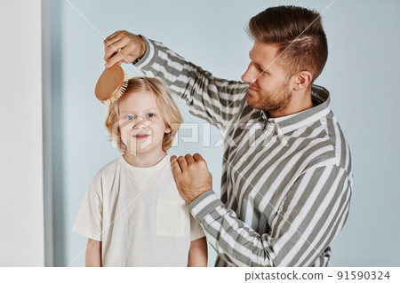 Father and Son Building Together 91590324