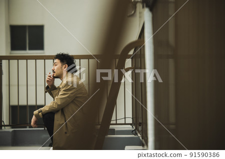 A bearded man in a trench coat that looks like a police drama 91590386