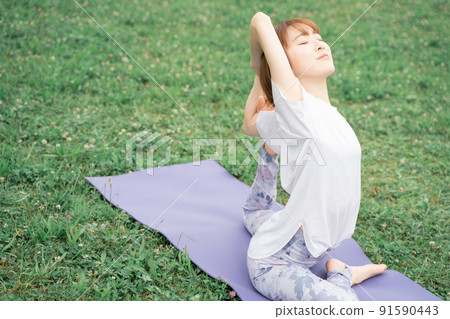 Park yoga half pigeon pose 91590443