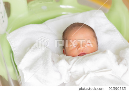 Baby sleeping in bed Newborn 91590585