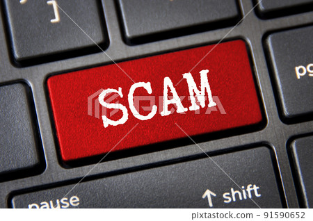 Scam text on red laptop tab. Online and cyber security concept 91590652