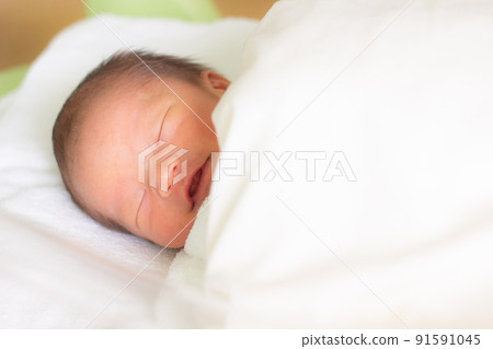 A smiling baby, a newborn baby A smiling baby, a newborn baby 91591045