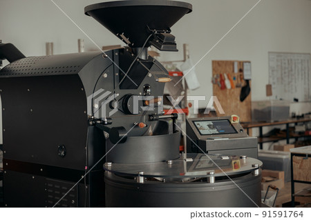 Close up of coffee roasting machine in small coffee manufacturing 91591764